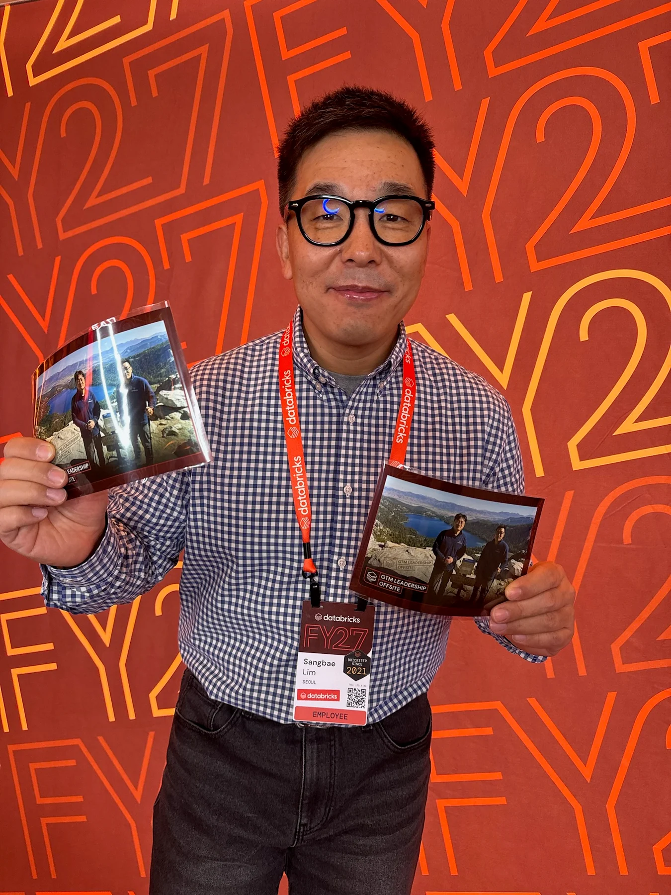 Attendee holding multiple finished photo keepsakes