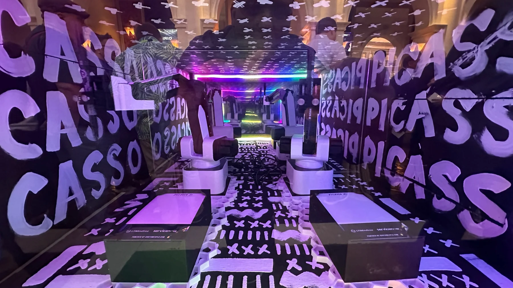 Purple lit SketchBot drawing interior at the event