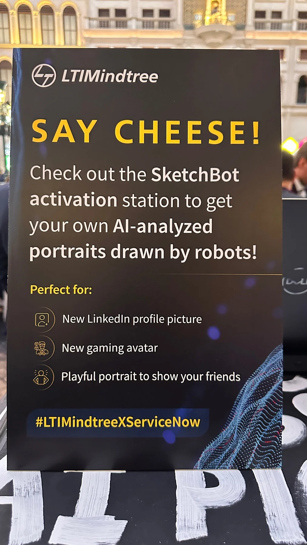 LTIMindtree Say Cheese instruction sign describing AI portraits drawn by robots