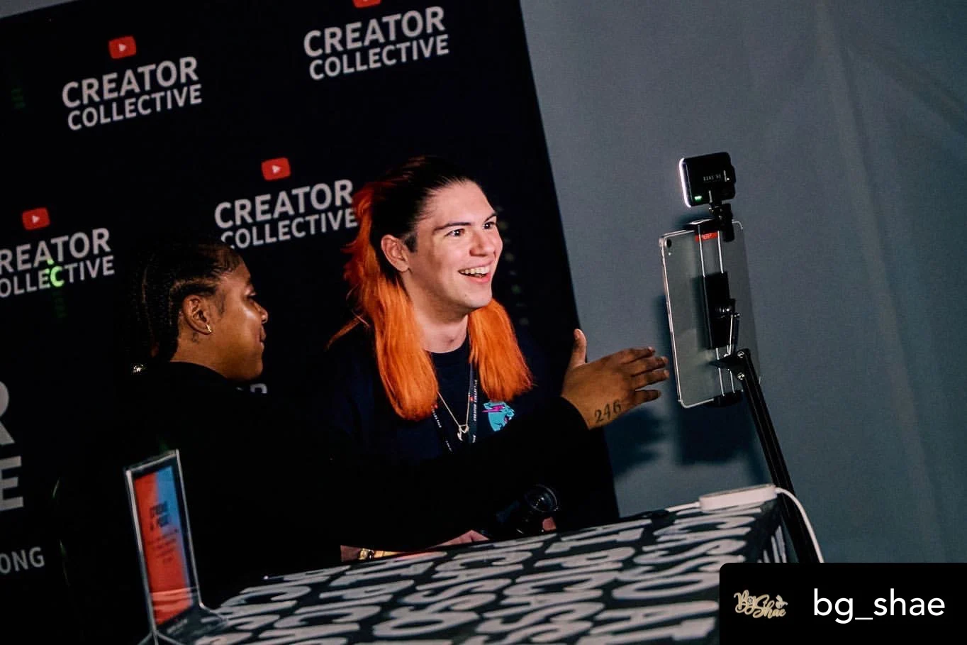 Guests at SketchBot capture area in front of Creator Collective backdrop