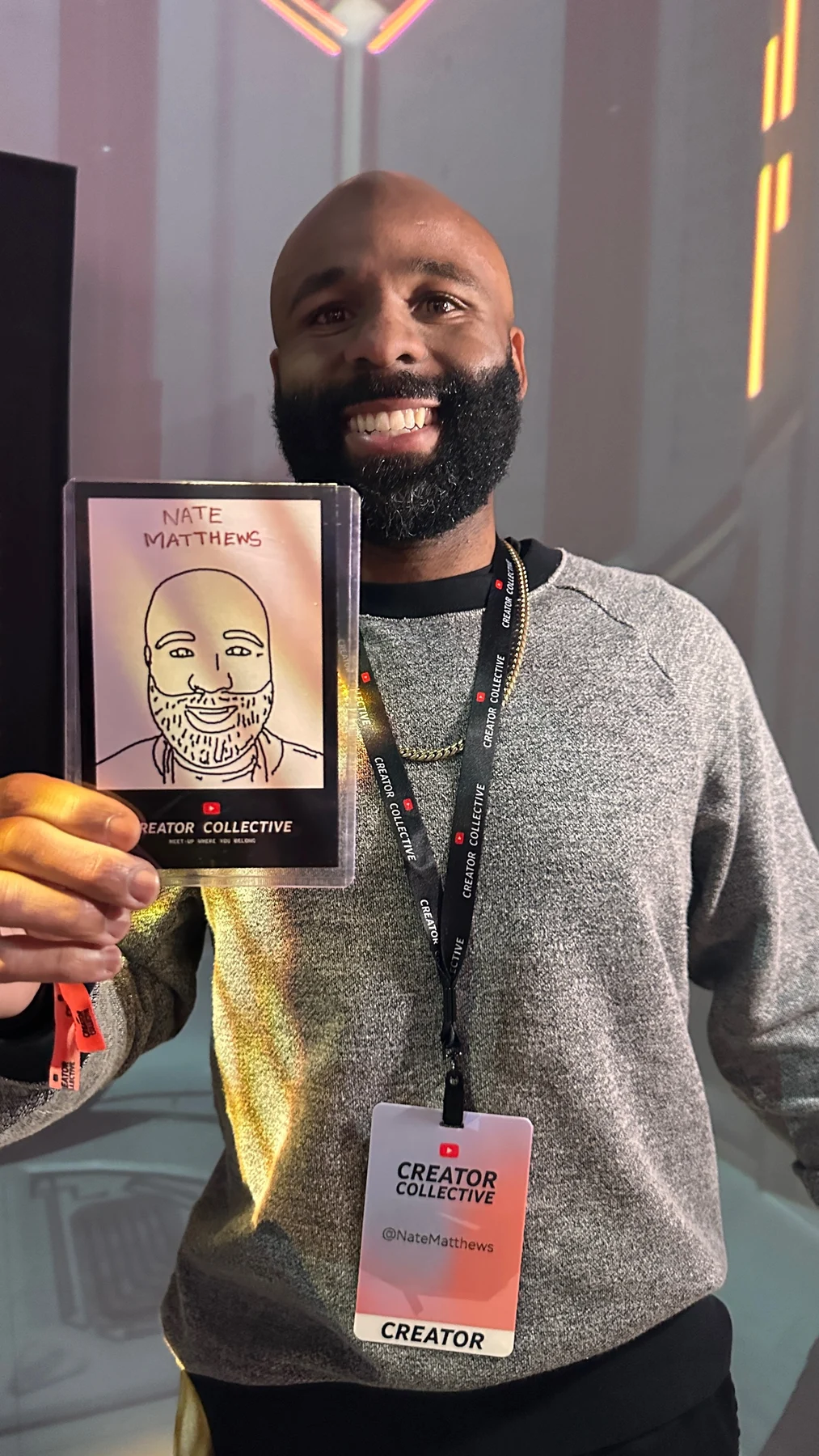 Guest holding his finished robot-drawn portrait