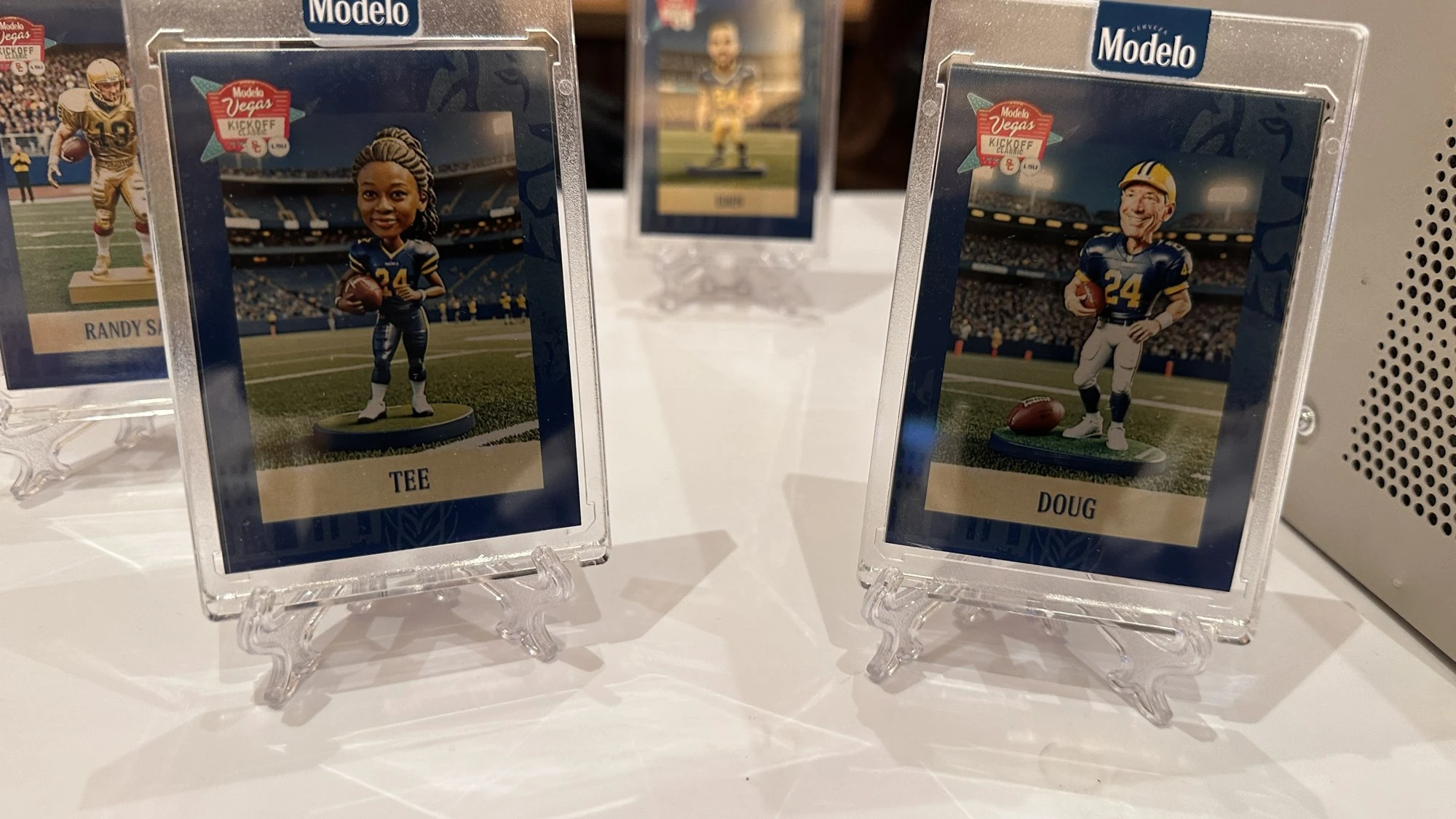 Modelo-branded personalized cards displayed in protective cases