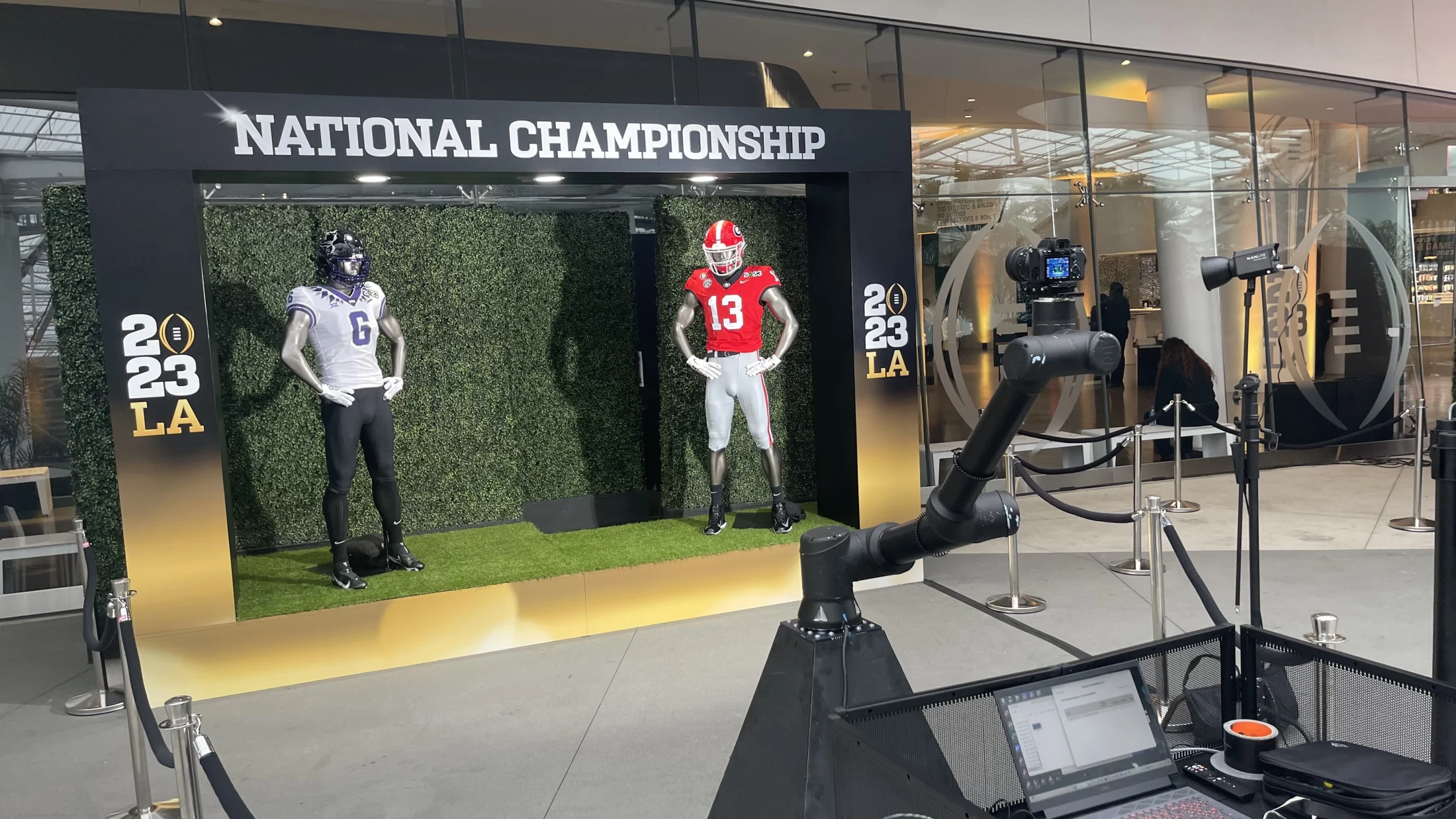Robotic camera and lighting facing jersey mannequins at the 2023 championship set