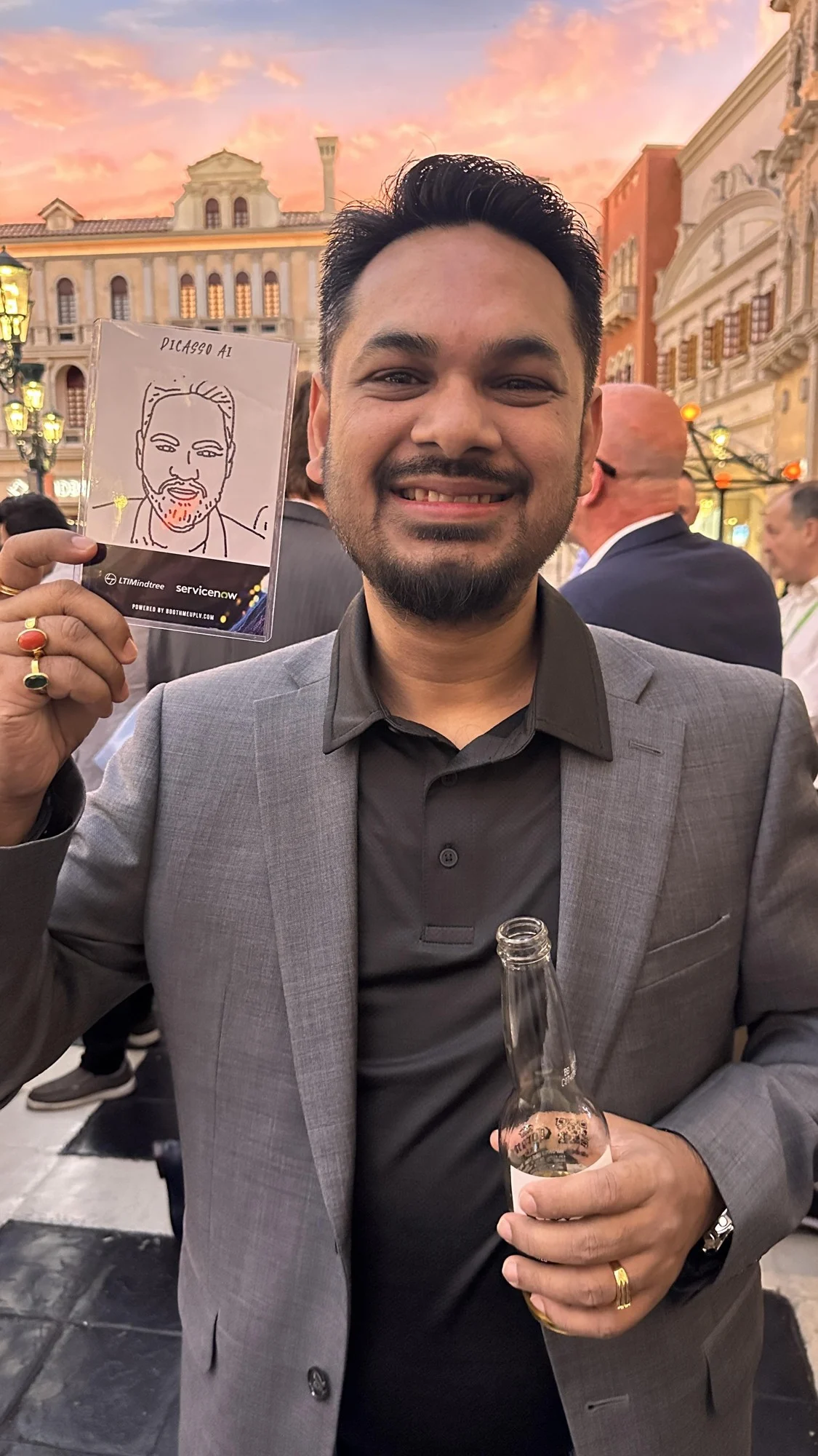 A guest holding a LTIMindtree × ServiceNow robot-drawn portrait