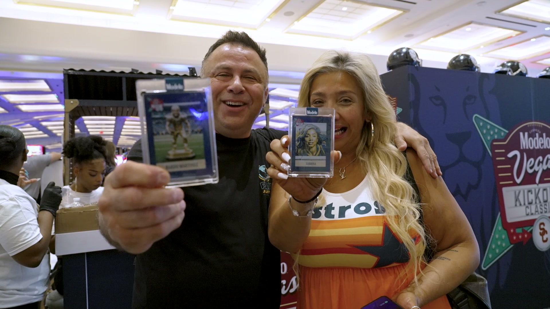Guests displaying their personalized AI trading cards at a BoothMeUp activation