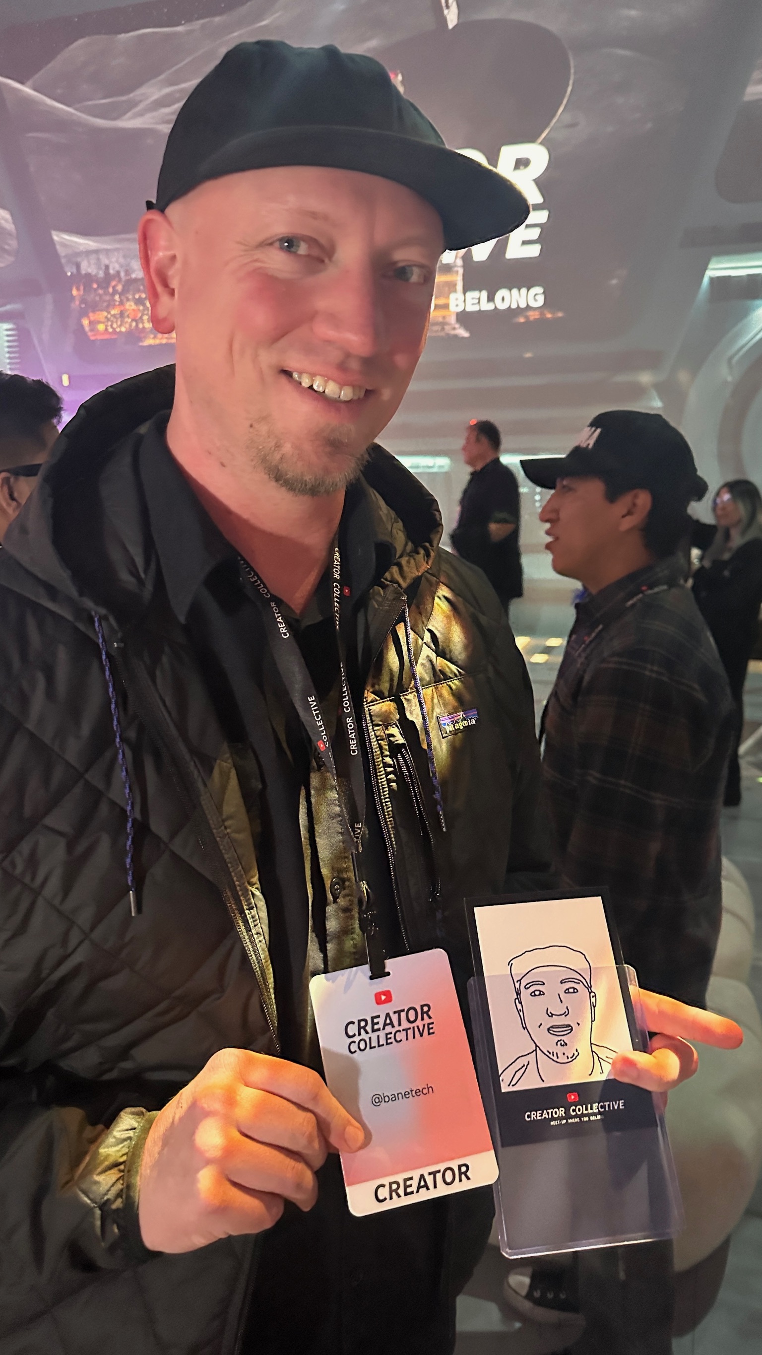 A Creators Collective guest with a finished robot-drawn keepsake