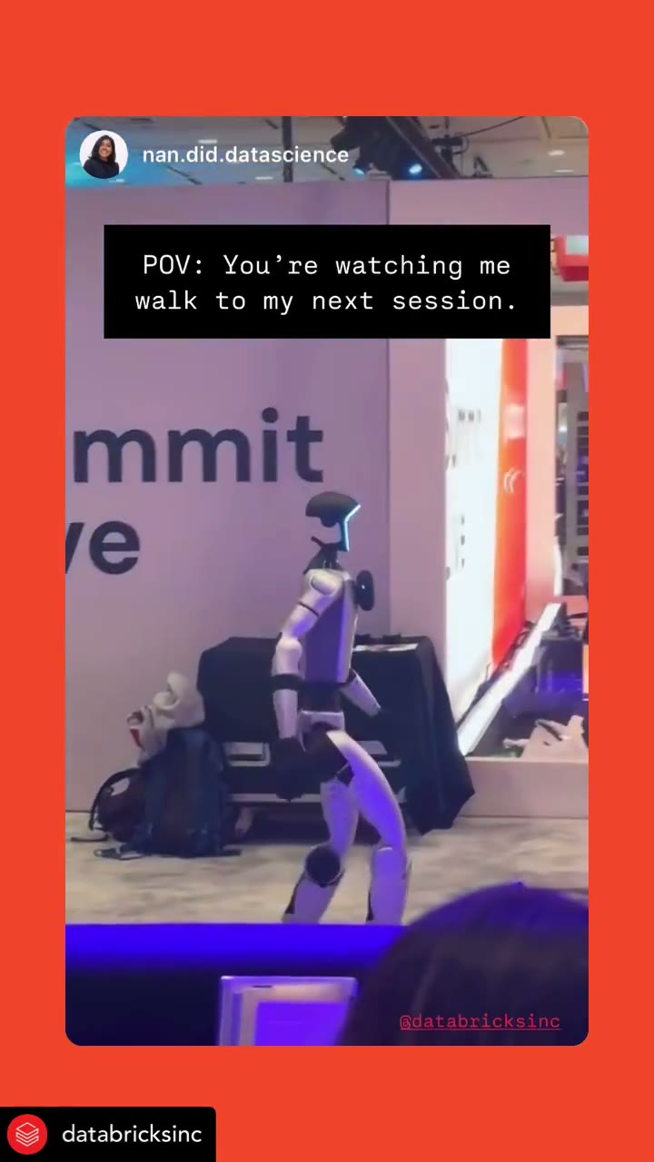 Henry Humanoid moving through a branded conference environment
