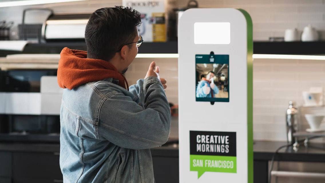 Selfie XP drop-off booth with tablet and integrated lighting