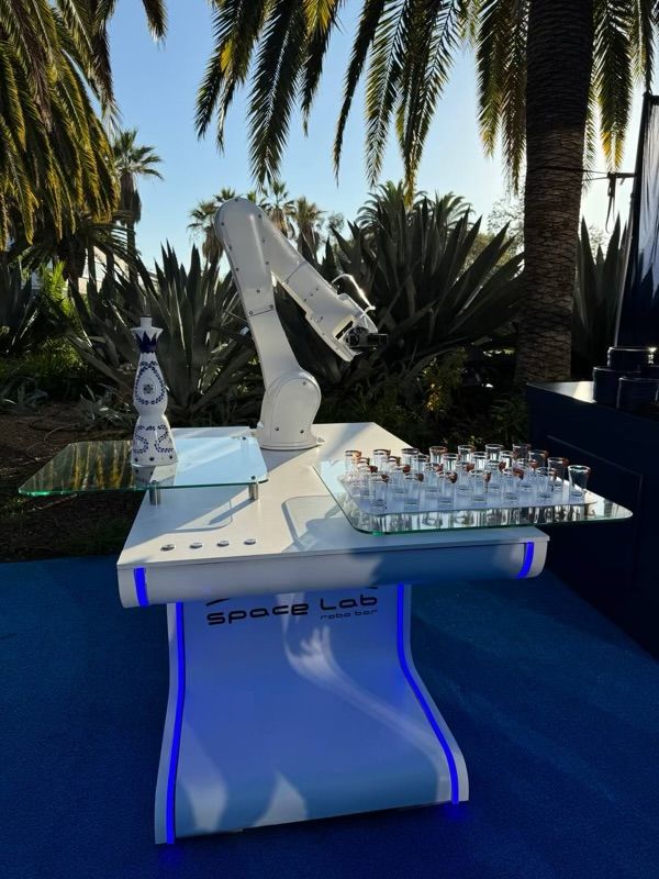 Robotic bartender preparing drinks inside an event activation