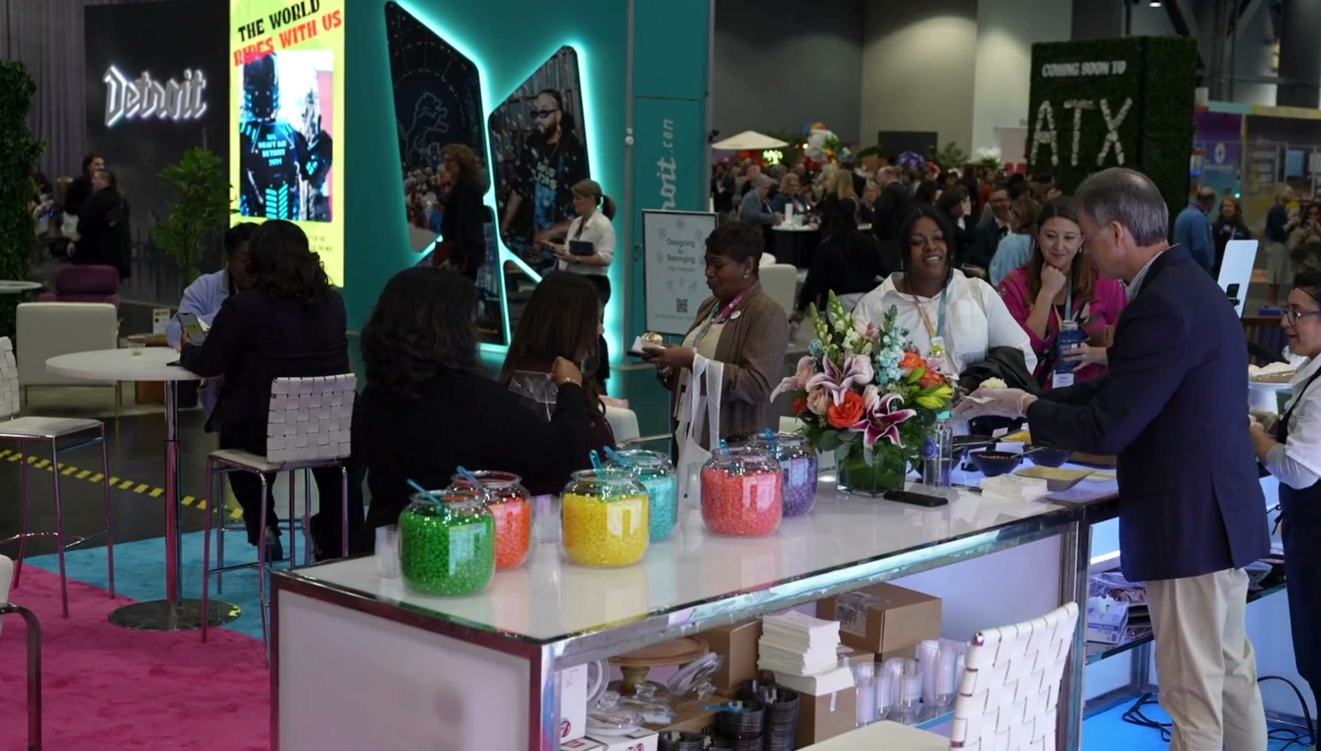 Guests gathering at a live event hospitality counter, supplied by Zenus
