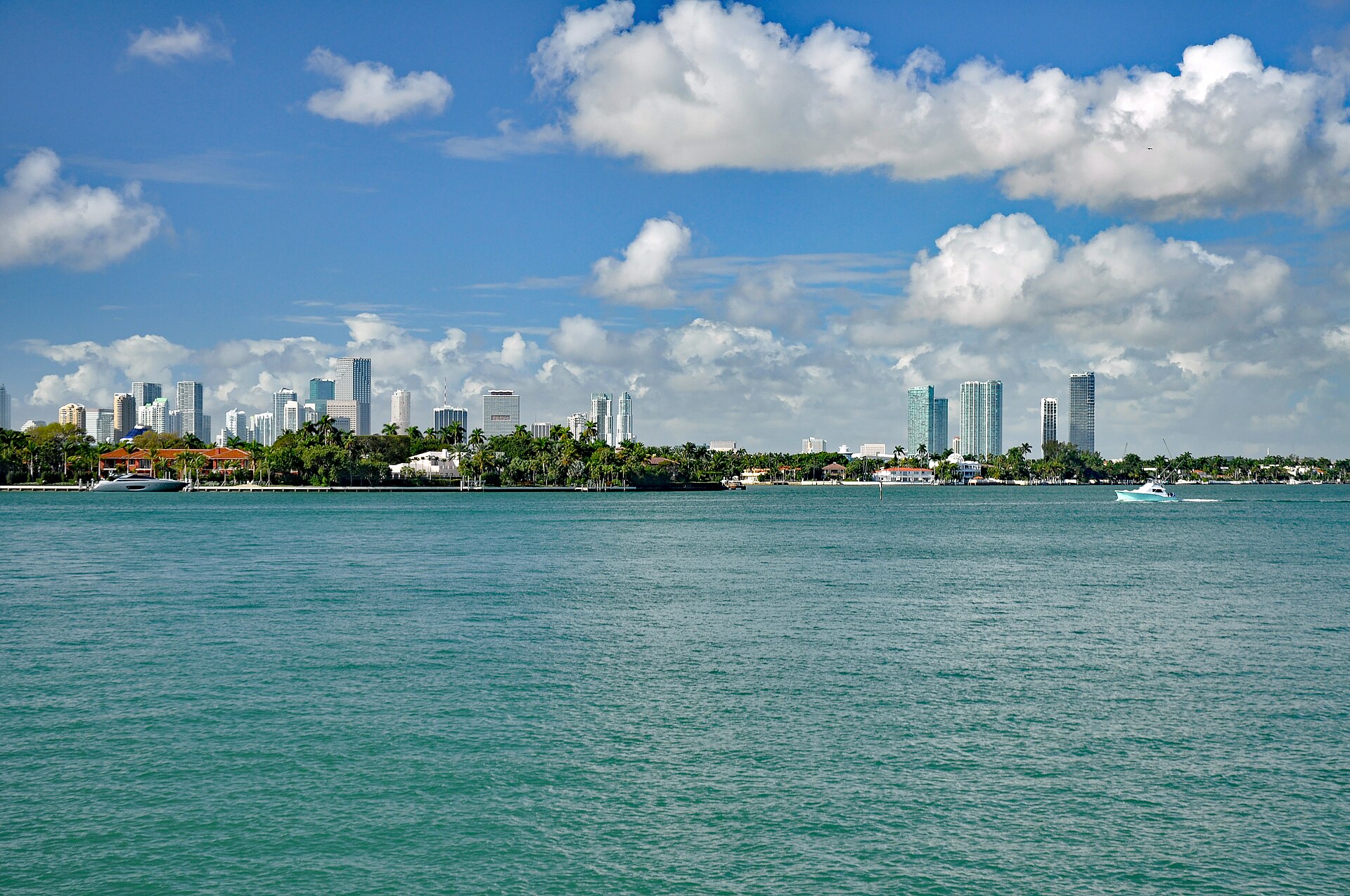Miami skyline across Biscayne Bay under a vivid blue sky