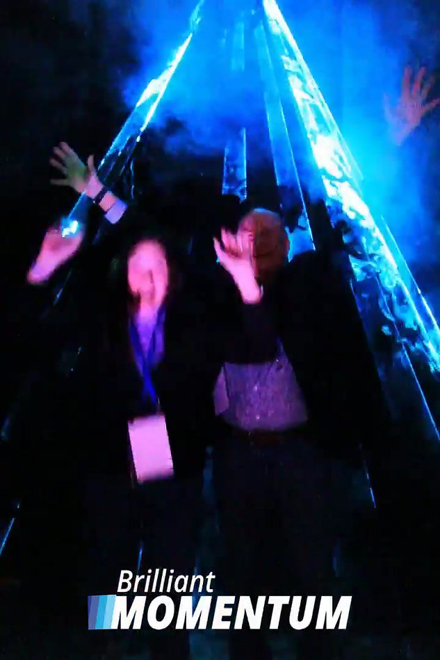 Two guests creating a branded overhead laser boomerang video