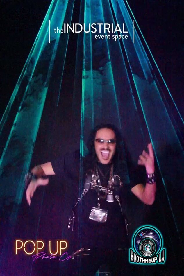 Guest moving beneath the turquoise laser canopy at a live BoothMeUp activation
