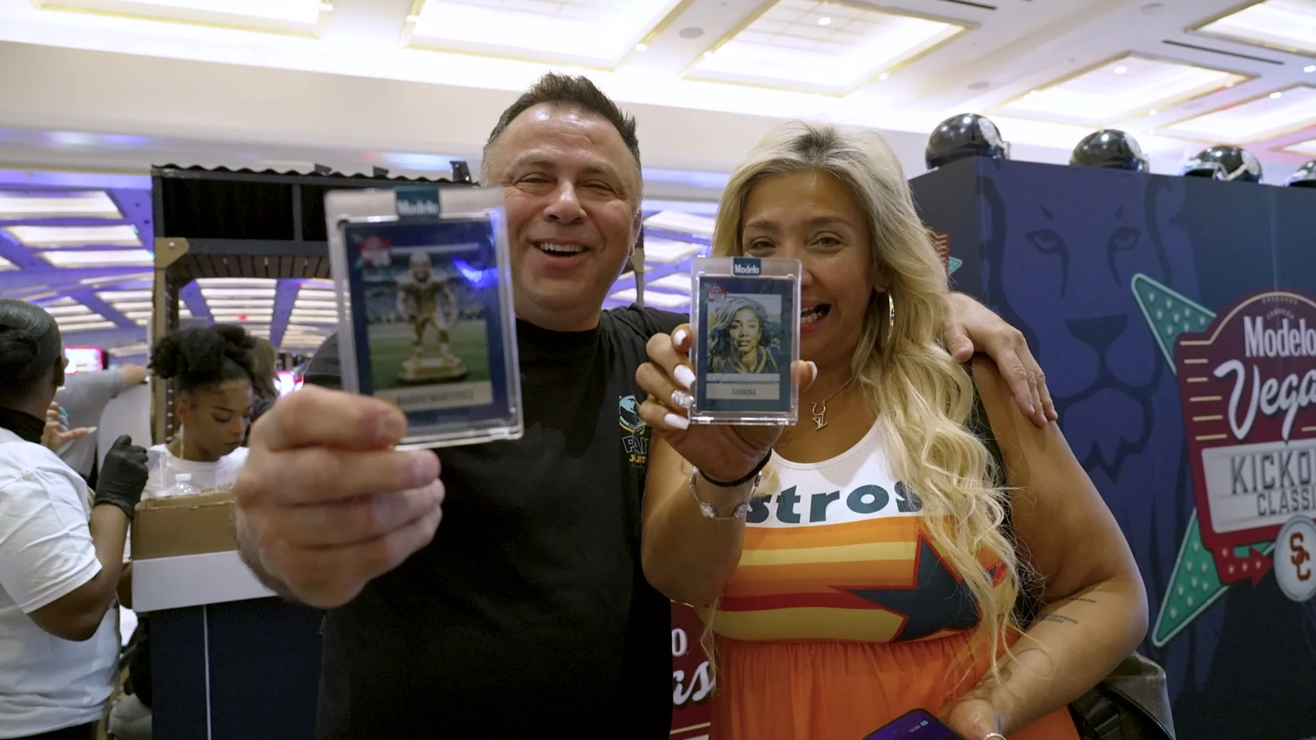 Guests displaying their personalized AI trading cards at a BoothMeUp activation