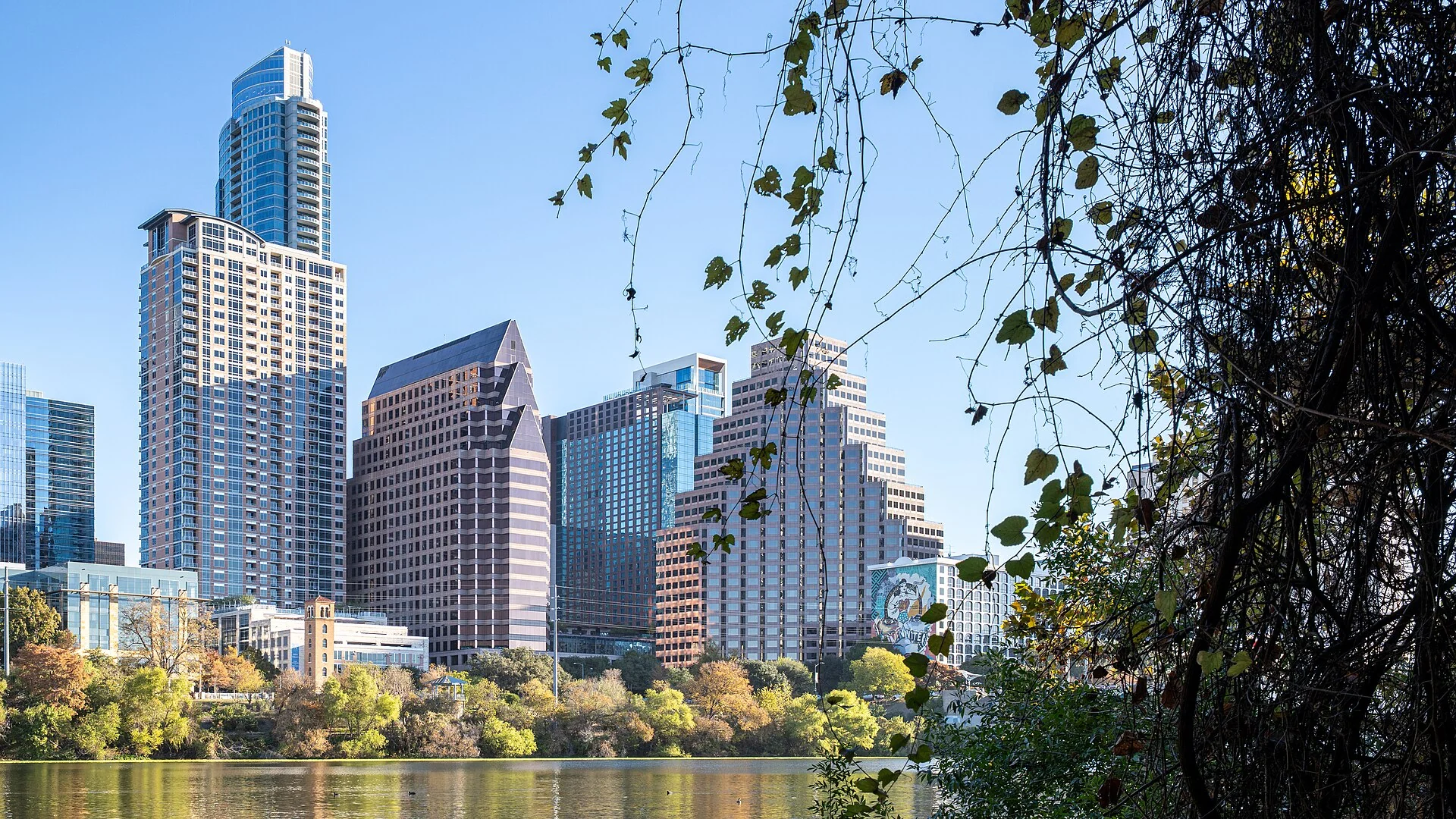 Downtown Austin skyline reflected across Lady Bird Lake